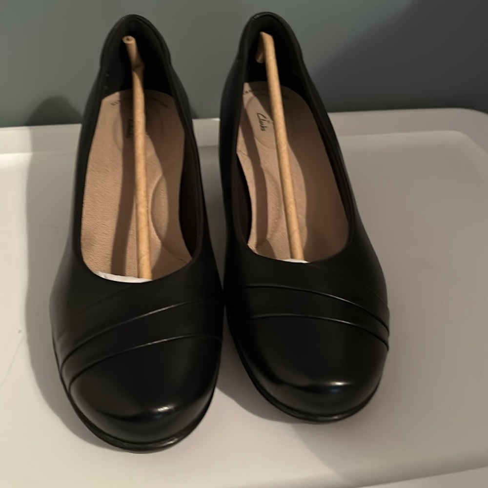 Black leather pumps